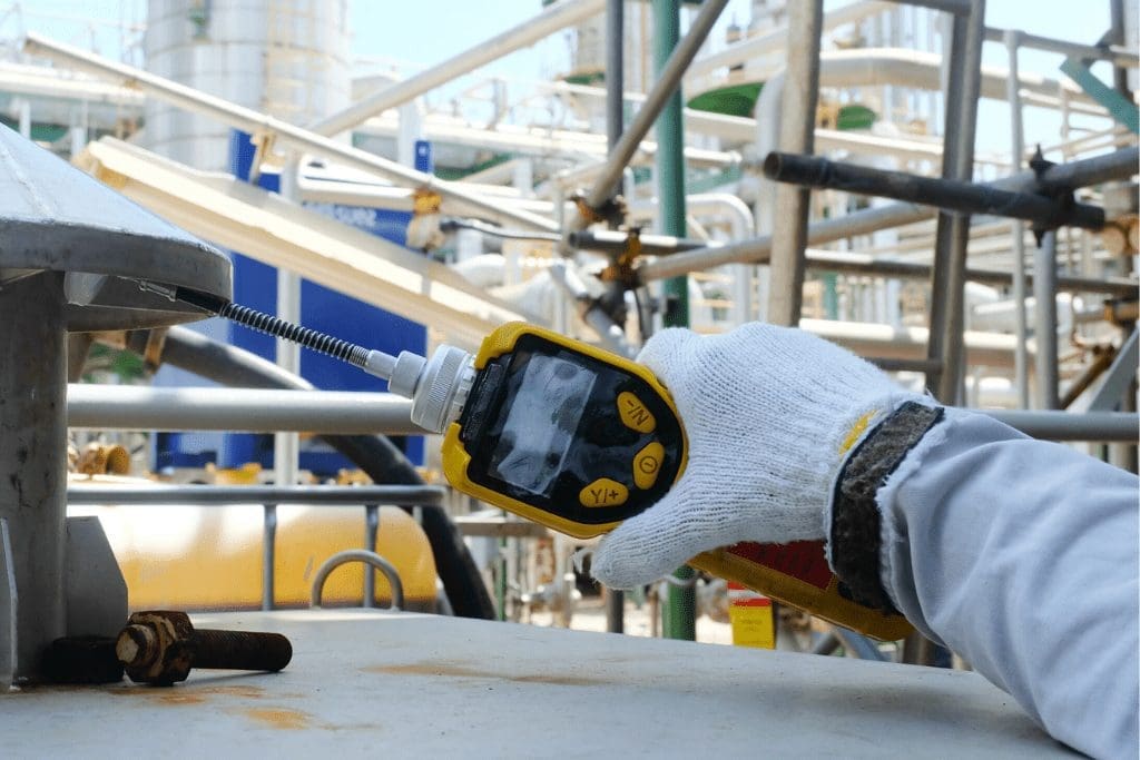 Close up of hand holding VOC detector